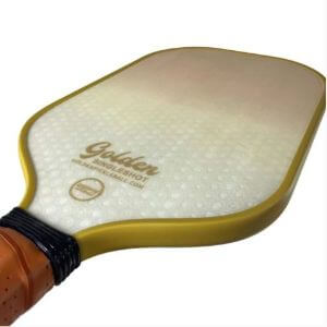 Gold Colored Edge Guard Of A SingleShot Pro Golden Pickleball Paddle